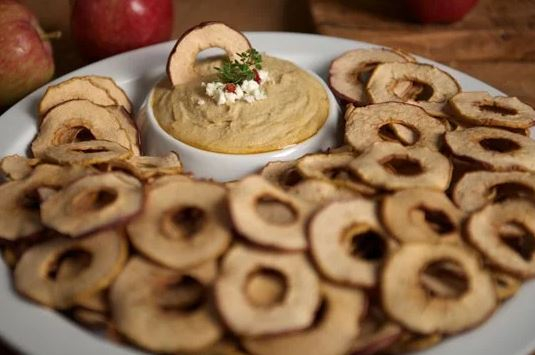 Crispy apple chips with a hummus dip